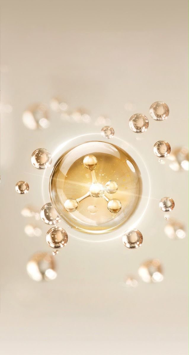 Golden molecular sphere suspended among luminous droplets on a cream background
